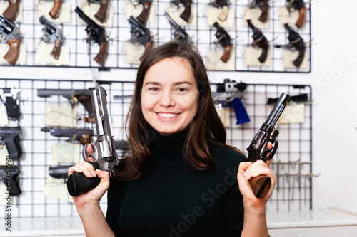 Seller demonstrates a combat winchester in the gun store