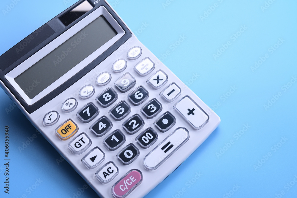 Calculator keypad on a blue background. Top view. Copy space Calculator keypad on a blue background. Top view. Copy space