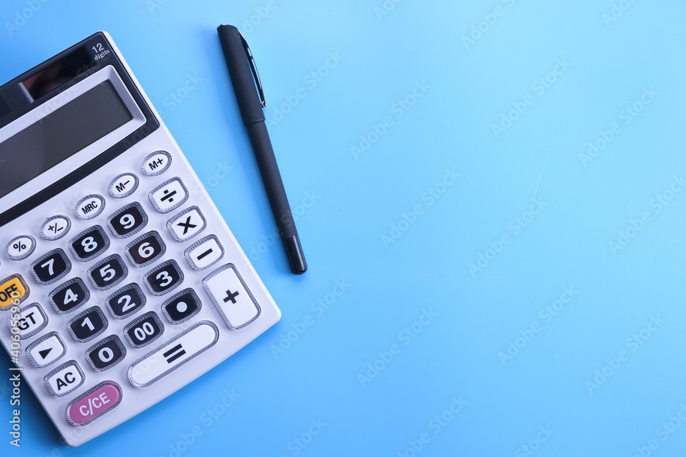 Calculator keypad on a blue background. Top view. Copy space Calculator keypad on a blue background. Top view. Copy space