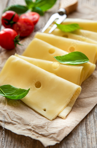 Sliced cheese, basil and tomatoes