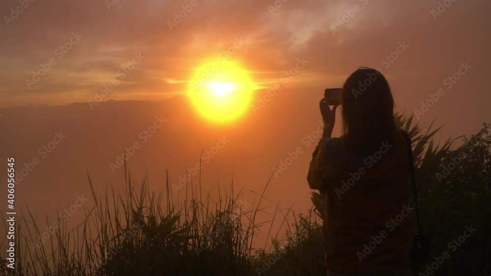 Silhouette of woman using mobile phone in golden field and beautiful sunset. Silhouette of woman using mobile phone in golden field and beautiful sunset.