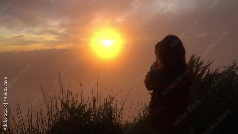 Silhouette of woman using mobile phone in golden field and beautiful sunset. Silhouette of woman using mobile phone in golden field and beautiful sunset.