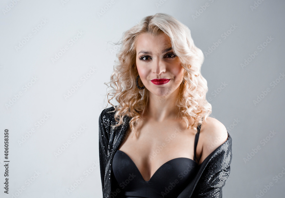 Naklejka premium Pin-up girl vintage. Wow expressions of emotion. Beautiful woman pinup style portrait in dress and makeup, manicure nails hands, red lipstick and black dress, smiling face.