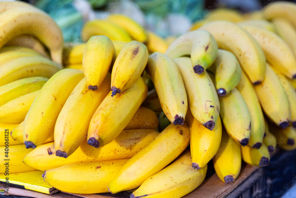 Bundles of ripe sweet bananas at farmers market