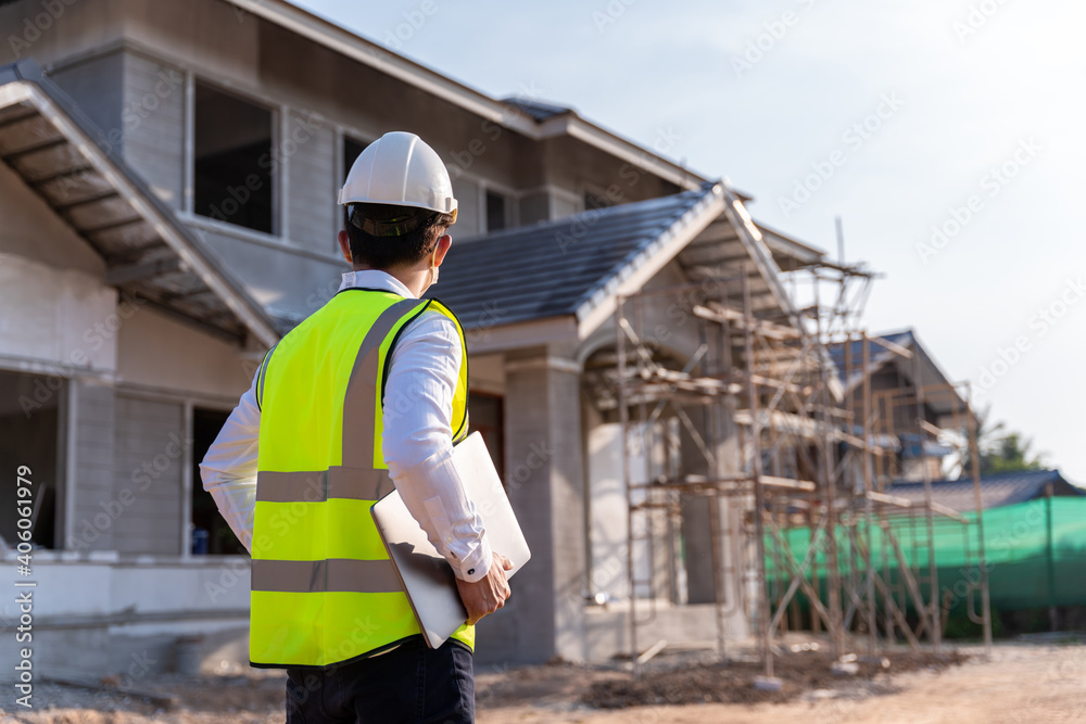 Architect watching some details on a construction, House builder concept. Architect watching some details on a construction, House builder concept.