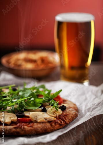 Pizza with Cheese, Tomatoes, Champignon, Olives and Arugola.