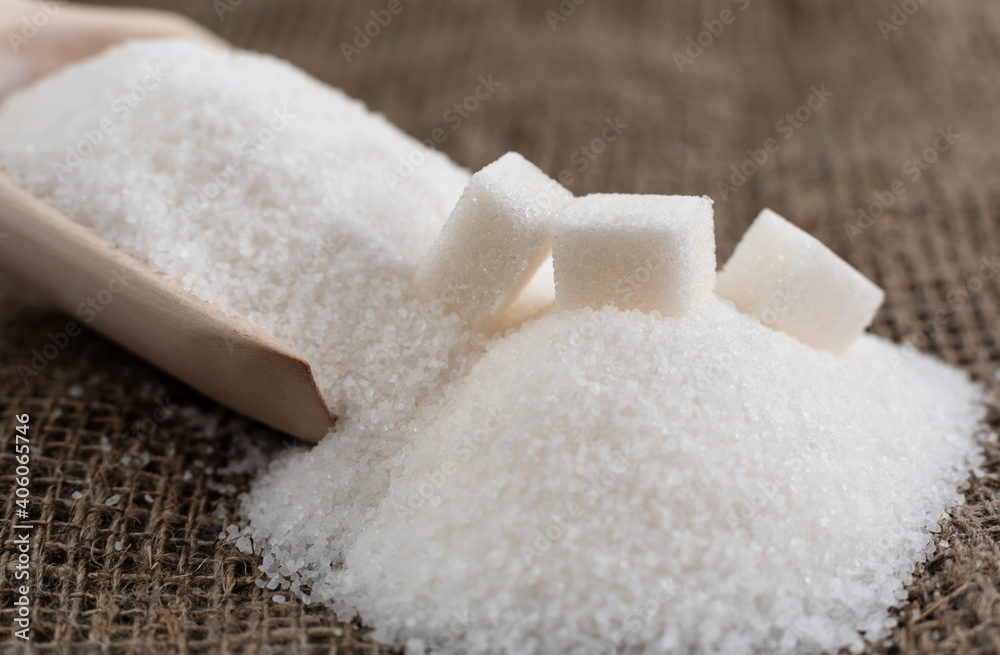 Scoop for bulk products with sugar. The scoop pours the sugar onto the cloth Scoop for bulk products with sugar. The scoop pours the sugar onto the cloth