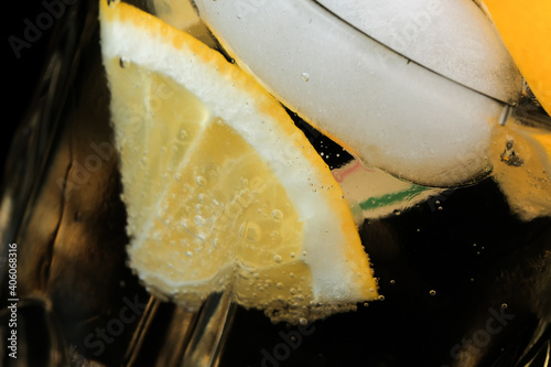 Lemonade drink with lemon and ice