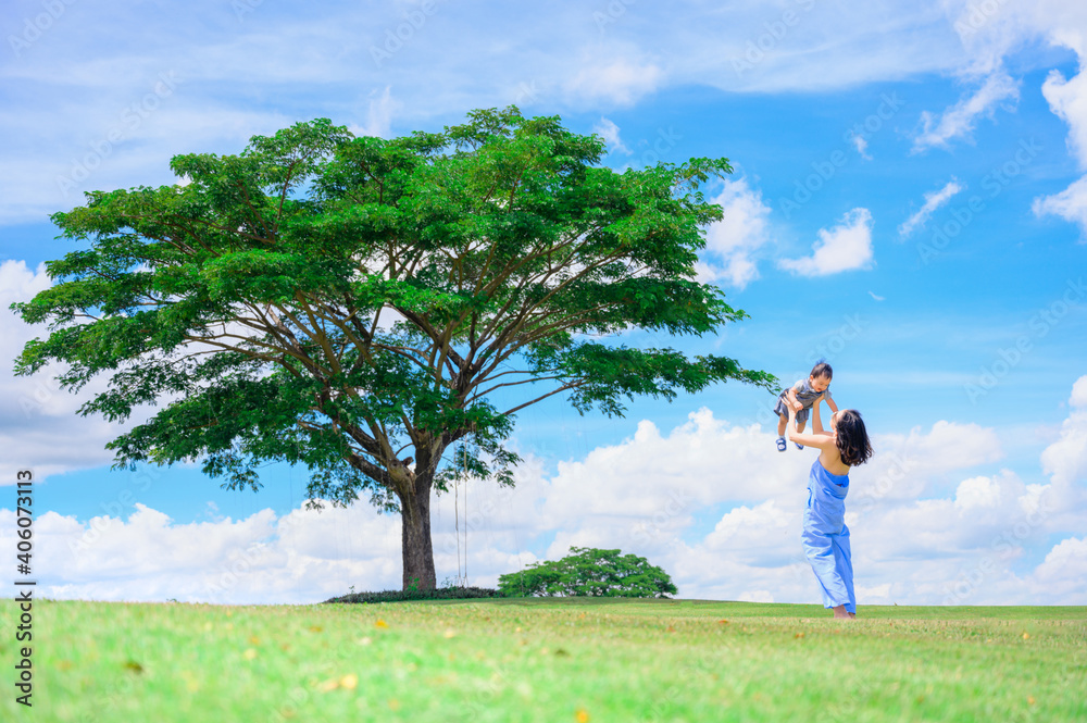Mother And Baby outdoors. Nature.Portrait of happy loving mother and her baby outdoors Mother And Baby outdoors. Nature.Portrait of happy loving mother and her baby outdoors