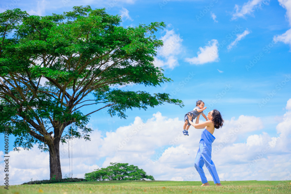 Mother And Baby outdoors. Nature.Portrait of happy loving mother and her baby outdoors Mother And Baby outdoors. Nature.Portrait of happy loving mother and her baby outdoors