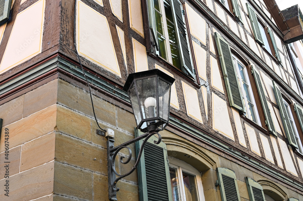 An old street lamp on a half-timbered house in the old town of Schwäbisch Hall, Germany.