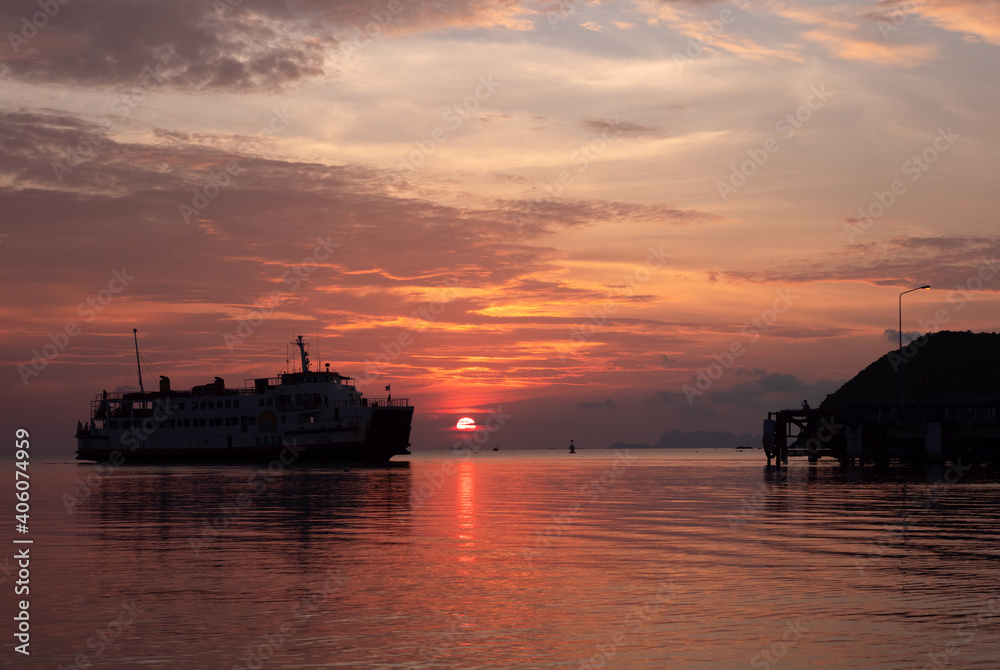 Raja Ferry arrive to koh Phangan pier in sunset time