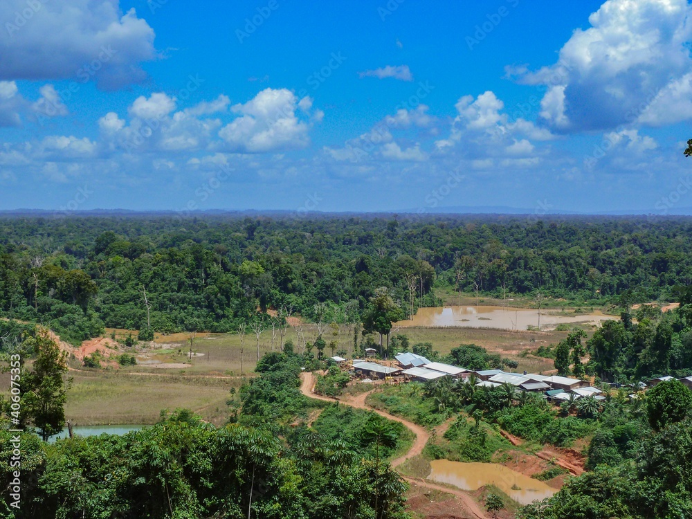 Camp of gold miners in rainforest of Guyana with deforested area around. Deforestation of Amazon and Essequibo rivers basin.