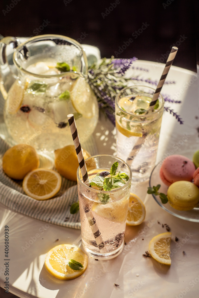 a romantic little table in a cafe in the sun, with lemonade and macaroon and lavender a romantic little table in a cafe in the sun, with lemonade and macaroon and lavender