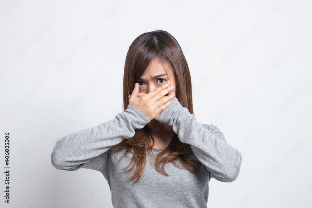 Beautiful young Asian woman close her mouth. Beautiful young Asian woman close her mouth.