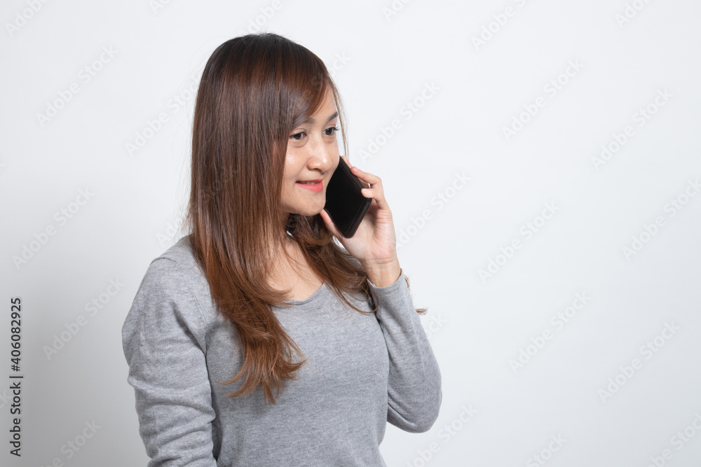 Young Asian woman talking with mobile phone. Young Asian woman talking with mobile phone.