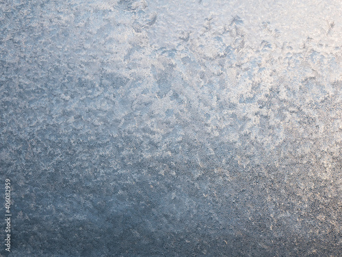 Glowing texture of window ice. Frosting background © Valkantina