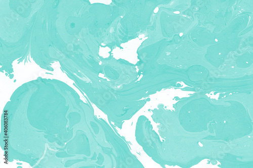 Aqua marble ink texture on watercolor paper background. Marble stone image. Bath bomb effect. Psychedelic biomorphic art.