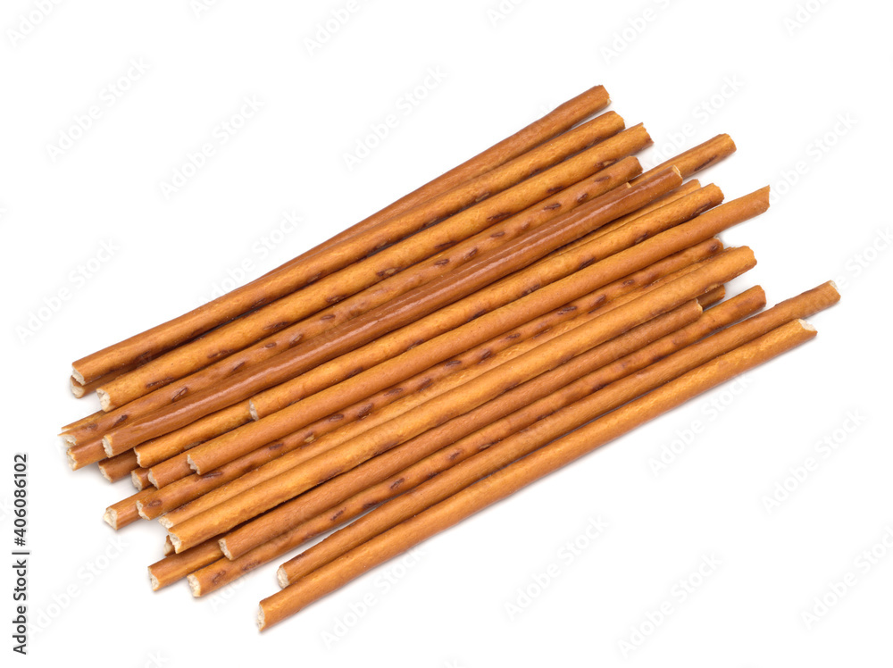 Sweet straws. Dry baked goods in the form of thin sticks. White background.