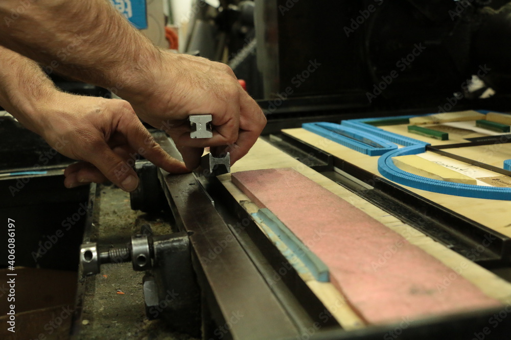 printing boiler cutting machine knife preparation moment. selective focus is used. printing boiler cutting machine knife preparation moment. selective focus is used.