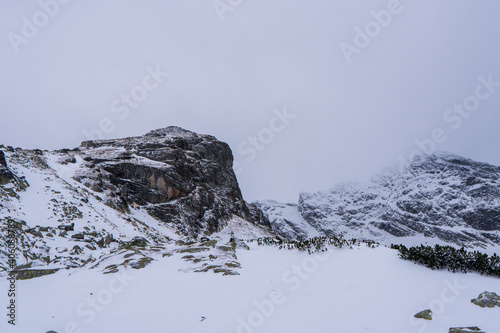 Fototapeta Naklejka Na Ścianę i Meble -  Winter mountains panoramic view with clouds. Tatras mountain in poland europe. Koscielec