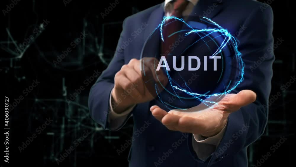 Businessman shows concept hologram text Audit on his hand. Man in business suit with future technology screen and modern cosmic background Businessman shows concept hologram text Audit on his hand. Man in business suit with future technology screen and modern cosmic background