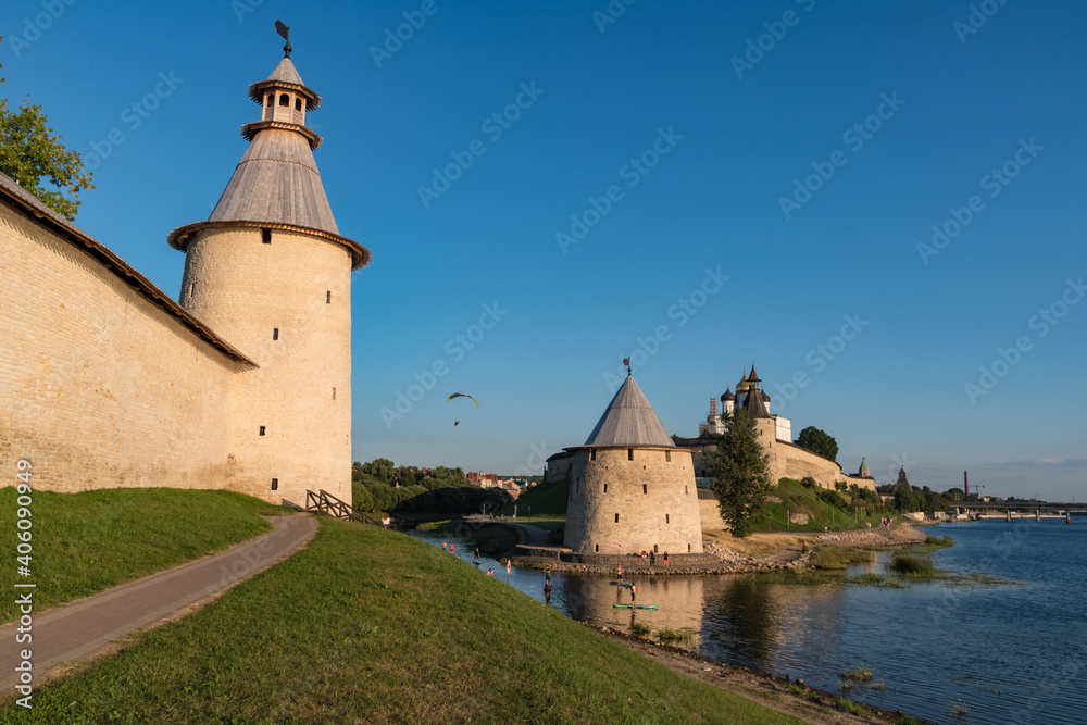 Pskov Kremlin view from river Pskova creek. Towers, wall and Trinity cathedral on background. Russia
