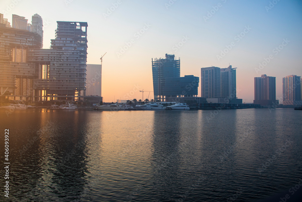 Naklejka premium Dubai, UAE - 01.15.2021 Sunrise over a Dubai water canal. Outdoors