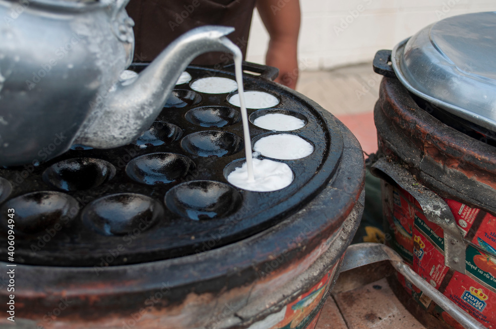Kanom Krok Phueng, a traditional Thai dessert made from crushed coconut meat.