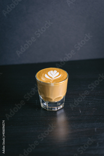 Cup of coffee on a table cortado