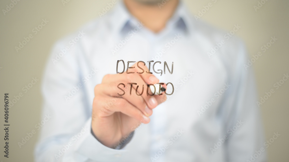 Design Studio, Man writing on transparent screen Design Studio, Man writing on transparent screen
