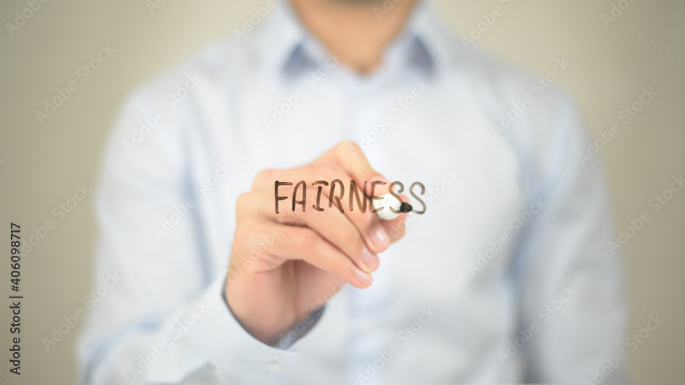 Fairness , Man writing on transparent screen Fairness , Man writing on transparent screen