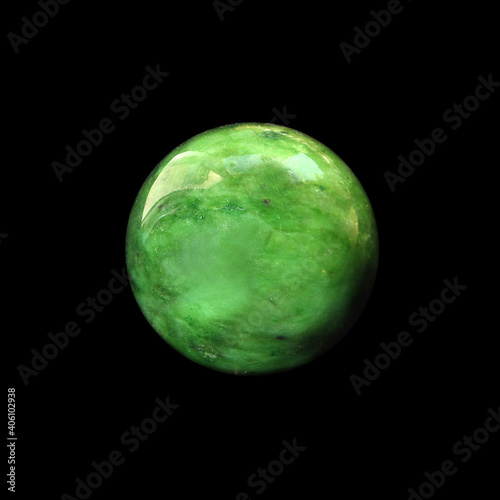 green nephrite ball on black background  photo