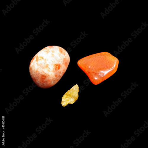 sunny stone, cornelian, heliodor on black background  photo