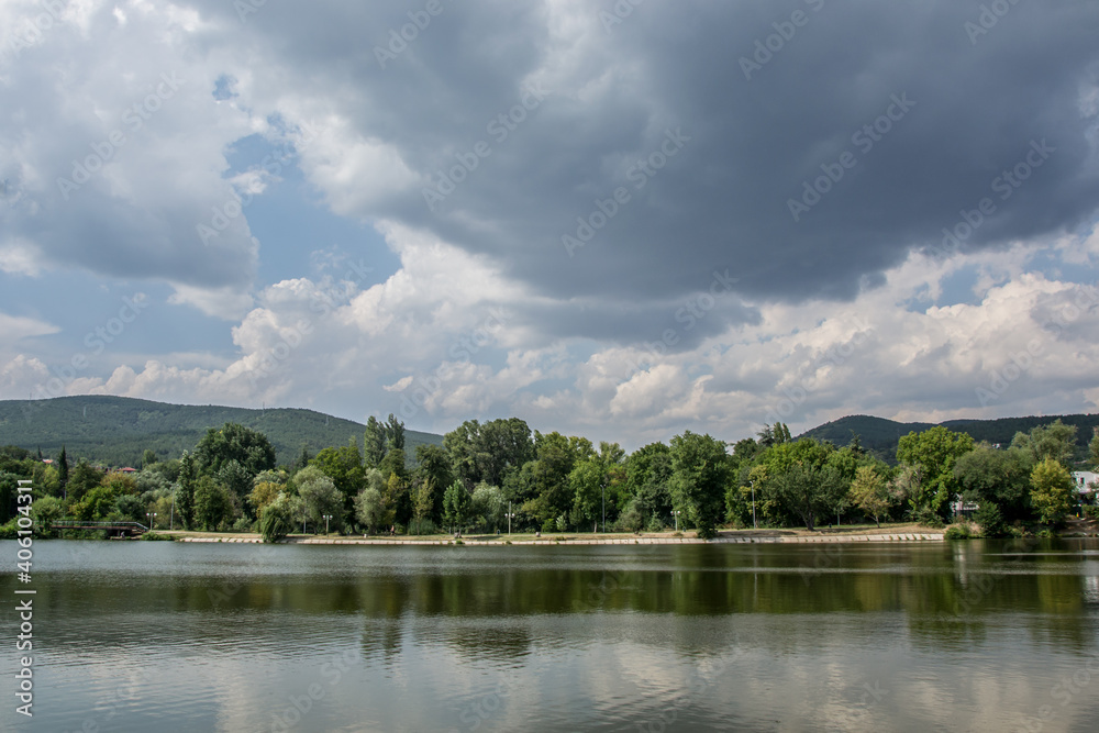 Beautiful peaceful nature, trees and plants on a lake, summertime season, reflection in the water, Zagorka lake, Stara Zagora, Bulgaria Beautiful peaceful nature, trees and plants on a lake, summertime season, reflection in the water, Zagorka lake, Stara Zagora, Bulgaria