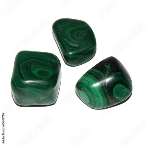 Obraz na plátně three malachite tumbled stones on white background