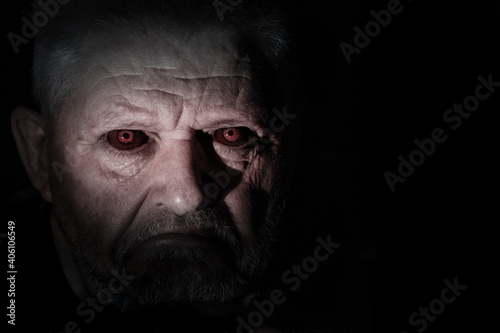 Portrait of an angry looking man with black eyes