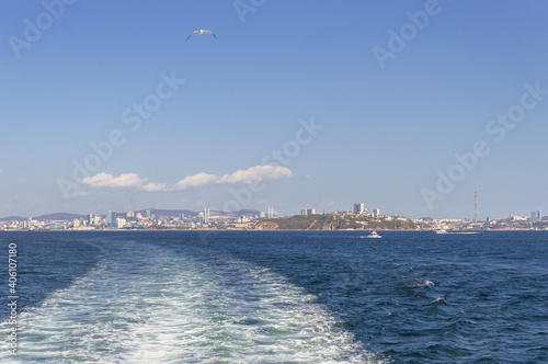 Vladivostok cityscape from afar with boats and sea view