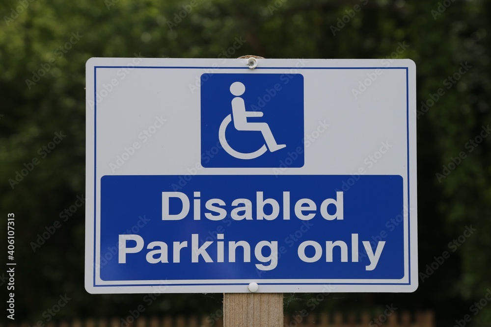 A closeup view of a disabled parking sign in a carpark. A closeup view of a disabled parking sign in a carpark.