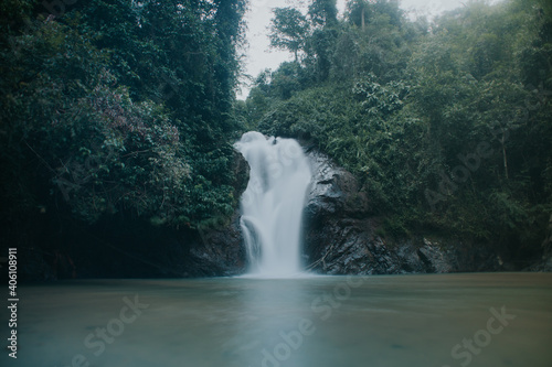 Beautiful view of rainforest waterfall in slow shutter mode.Soft focus due to slow shutter and high ISO shot.
