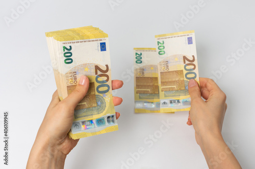 200 euro banknotes count by woman photo