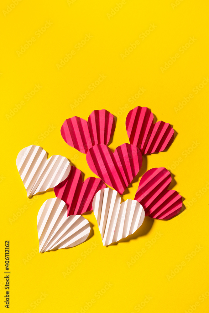 Valentine's day flat lay with copy space. Pink and white hearts on the yellow background. Image for greeting cards. Valentine's day concept Valentine's day flat lay with copy space. Pink and white hearts on the yellow background. Image for greeting cards. Valentine's day concept