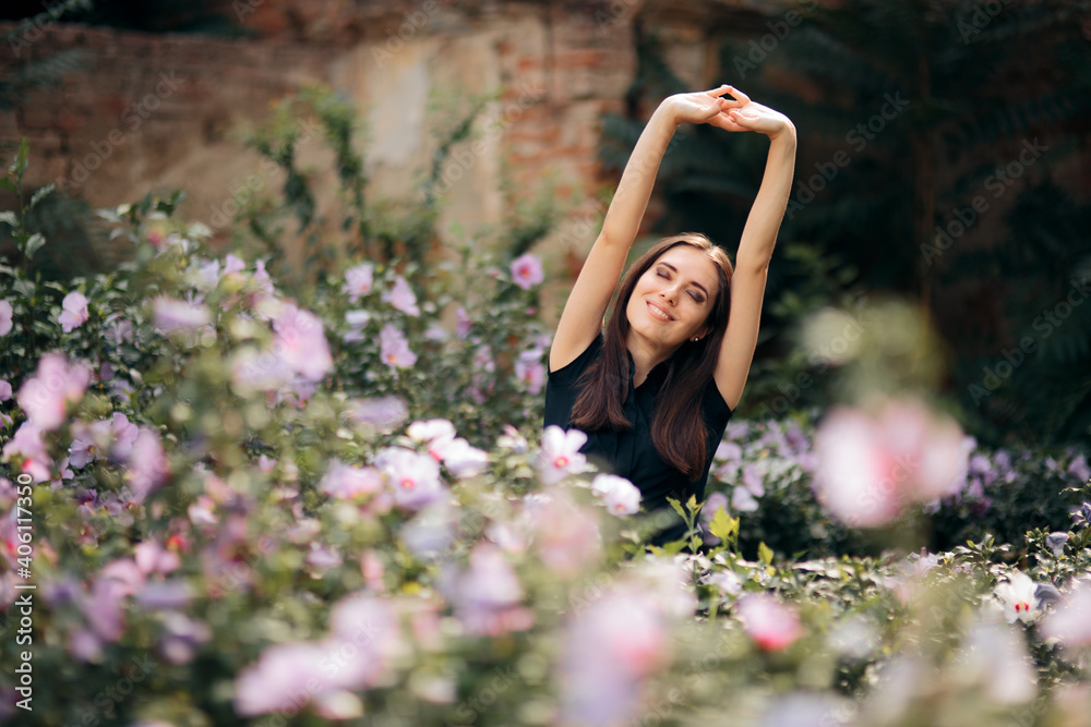 Happy Girl Surrounded by Flowers in Summer Season