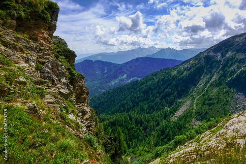 steep rocks with beautiful clouds while hiking