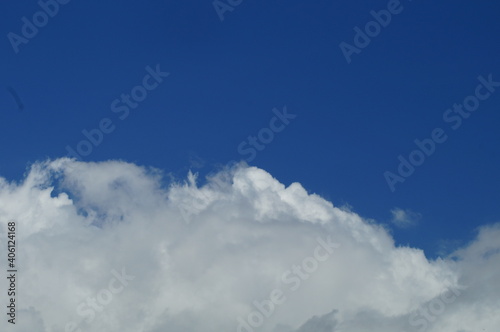 view of clouds in the clear blue sky during the day