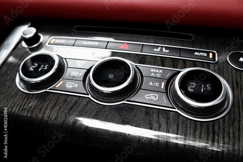 Air conditioning button inside a car. Climate control AC unit in the new car. Modern car interior details. Car inside. Car interior © Aleksei