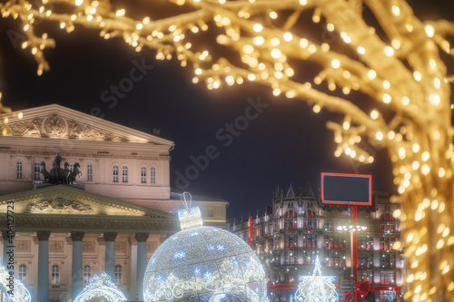 Bolshoi Theatre at night in Moscow. Central Universal Department Store TSUM. Russia at Christmas. City street decorated for holidays photo