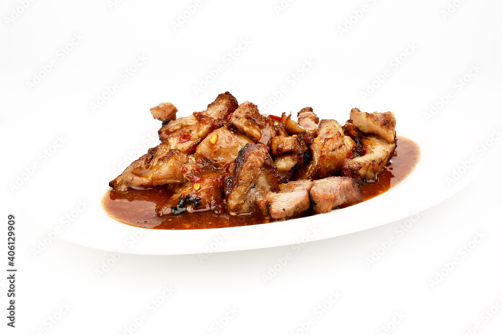 Assorted delicious Grilled pork and spicy sauce on a white plate isolated on white background Assorted delicious Grilled pork and spicy sauce on a white plate isolated on white background