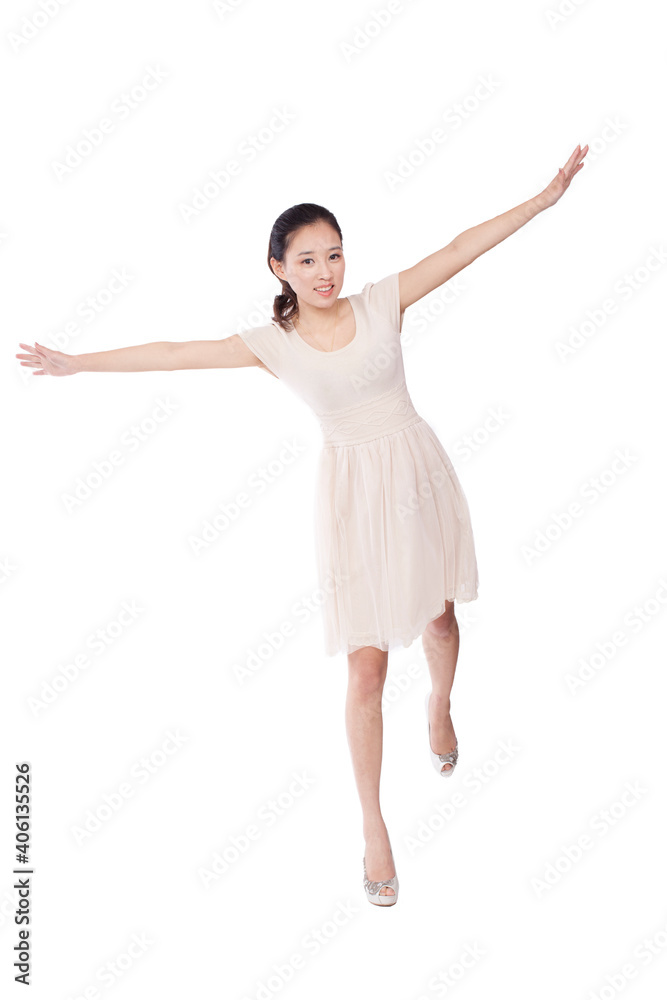 A Young woman standing with arms stretched A Young woman standing with arms stretched