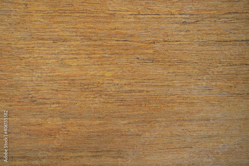 The smooth surface of the board or brown plywood.